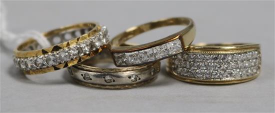 An 18ct gold Zirconium-set ring, two similar 9ct gold rings and another stone-set unmarked ring